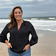 Jenny Weinberg headshot on the beach